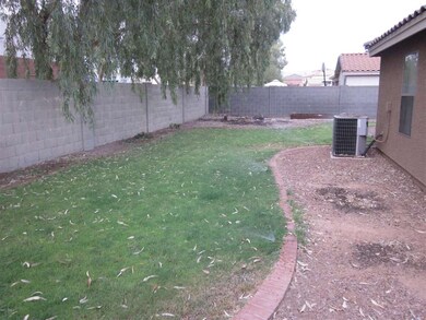 Grass in back yard with Sprinklers