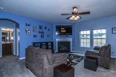 Living room has a gas fireplace.