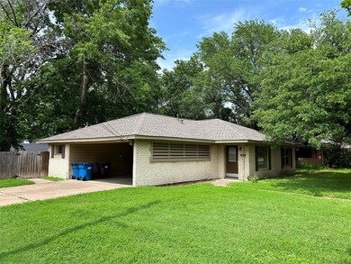 Ranch-style house with pretty front lawn