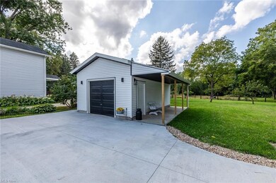 Garage with garage and a yard
