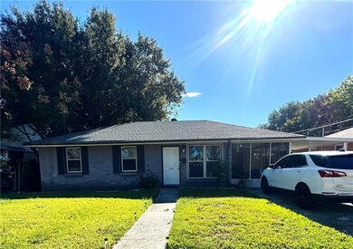 Attached screened in patio and carport.