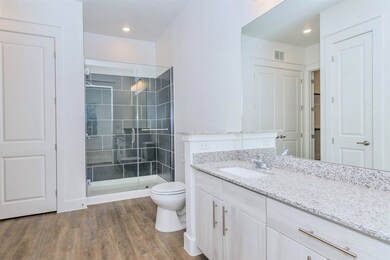 Bathroom with dual entry, walk in shower, modern w