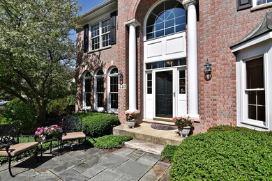 Beautiful entry setting with blue paver patio, per