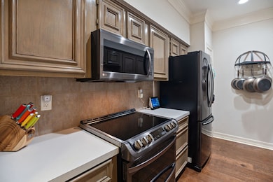 Another view of the kitchen with recently replaced cooktop/oven combo and microwave.