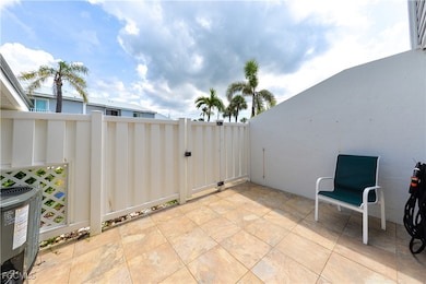 View of patio with a gate