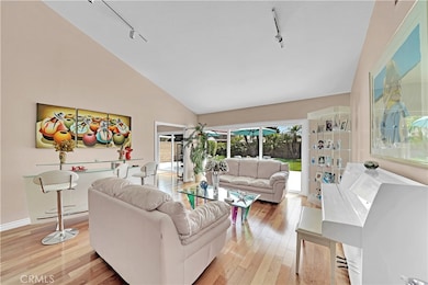 Living Room with beautiful flooring and view of Backyard.