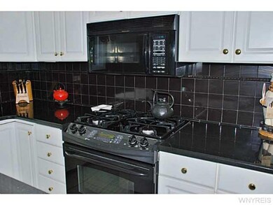Kitchen GE PROFILE RANGE AND BUILT IN MICROWAVE