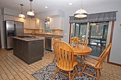 The bright eat-in kitchen is updated with beautifu