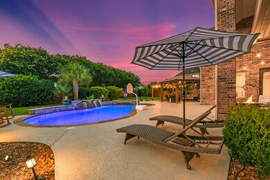 Picture yourself reclining on a beach lounger nestled in the refreshing pool waters, gazing towards the inviting pergola. It's a picturesque scene of relaxation and tranquility, where you can soak up the sun's warmth while enjoying the serene ambiance of your backyard oasis.