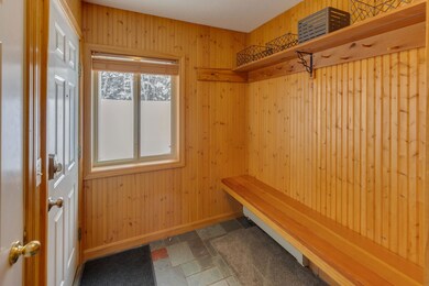 Expansive bench seating in mudroom