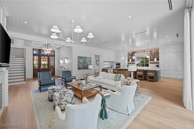 Living room with an inviting chandelier and light