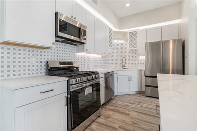 This kitchen will feature white shaker cabinets. C