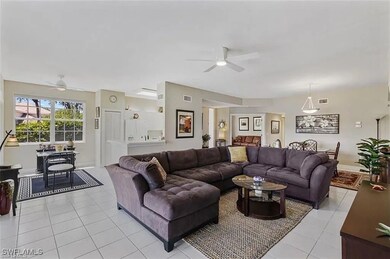 Living room with light tile patterned flooring and