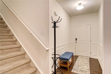 The front door brings you into the front foyer featuring decorative chair rail moulding and space to sit down and take off shoes, or hang up your bag and coat in their own special spot.  Stairs to the left lead you to three bedrooms, loft, and laundry room.