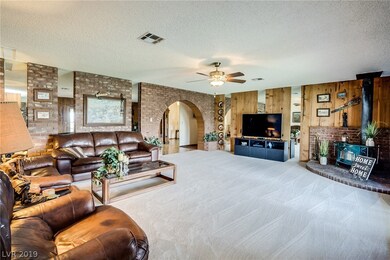 Family Room with Brick Accent Wall and New Carpet.