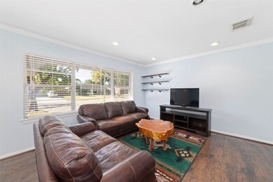 Warm, light-filled family room with new flooring and fresh paint throughout.
