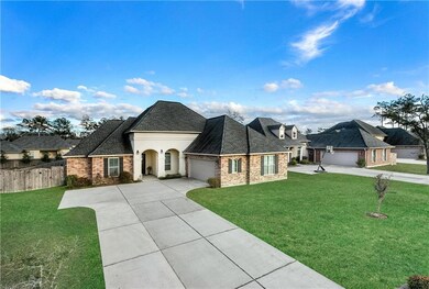 Front facade, over-sized driveway
