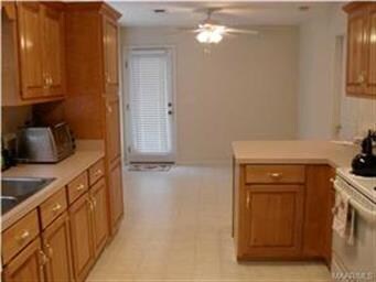 Informal eating area beyond cabinets can also work