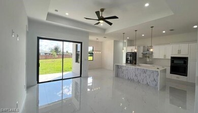 Kitchen featuring refrigerator with ice dispenser,