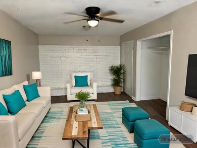 Living room with ceiling fan, dark hardwood / wood