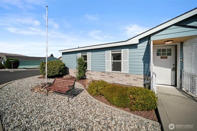 Shutters, lattice, curbing and decorative skirting give this home character.