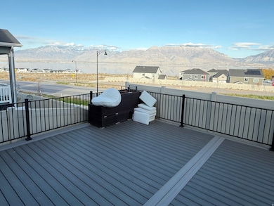 Wooden deck with a mountain view, a residential view, and area for grilling