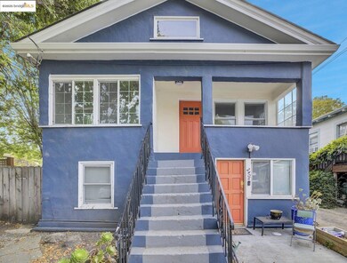 View of front facade with stucco siding and stairs