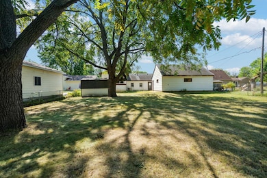 Huge fenced-in backyard with storage shed.