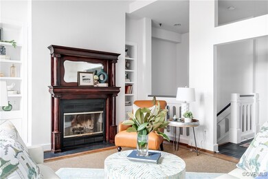 Carpeted living room with built in shelves