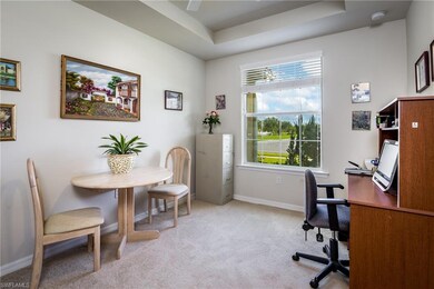 Den with tray ceilings, ceiling fan and beautiful 