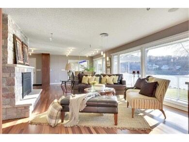 Great Room has wall of windows and deck access.