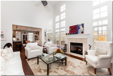 Flanking the fireplace, two sets of double height 