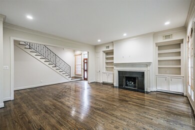 Living area offers a gas fireplace and built ins.