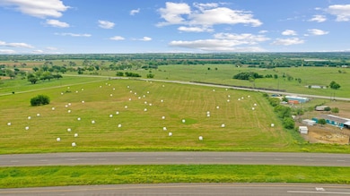 Birds eye view of property featuring a rural view
