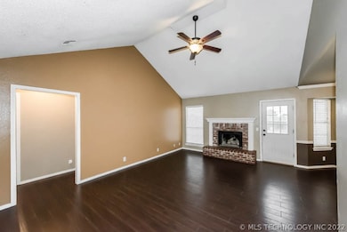 Living Room with Vaulted Ceiling & Wood Burning Fi