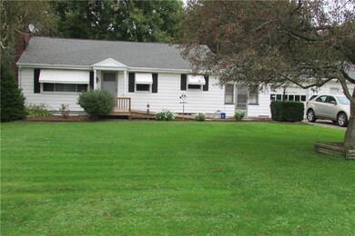 Front exterior of the house.  Breezeway and a 2 ca