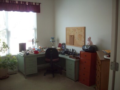 Den at front entry. Can be computer area or?