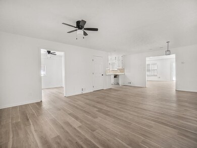 Unfurnished living room featuring light wood-type 