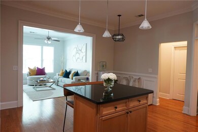 Kitchen featuring crown molding, a center island, 