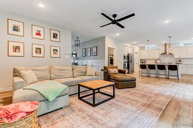 Living room featuring ceiling fan, and recessed li