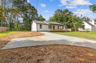 Bungalow-style home with driveway and a porch