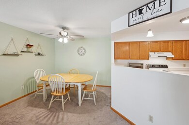 Lovely dining room with ceiling fan. open to kitchen and living room.