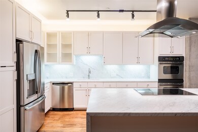 The newly renovated kitchen sports new cabinets, c