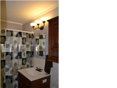 Remodeled Bath with a newer Vanity, Storage Cabine