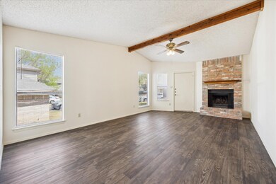Unfurnished living room featuring dark wood-type 