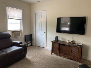 UNIT #1 LIVING ROOM/DOOR TO BED #1