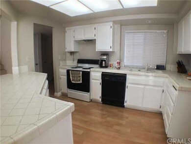 Kitchen with brand new flooring and paint.