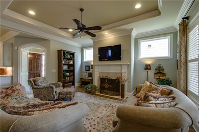 Another view from the living room to the entry foyer, plantation shutters control the light form the patio for watching TV.
