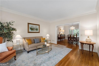 The living room and dining room have hardwood floors, bay windows and plantation shutters!