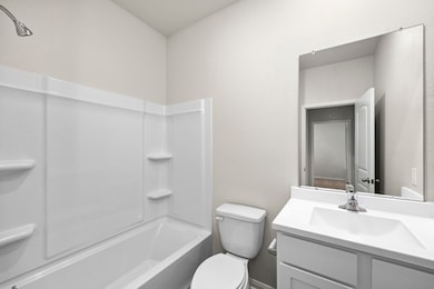 The secondary bathroom is conveniently located cen